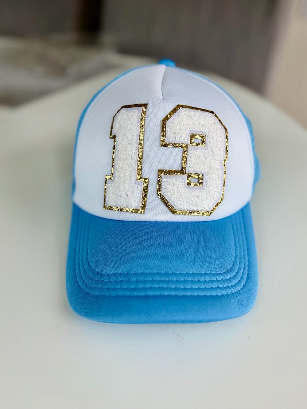 13 Trucker Hat Baby Blue with White and Gold Accents